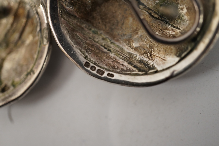 Elaine Coyne- A late 1980's modernist silver and cabochon garnet set drop brooch, 11.8cm, a pair of similar silver circular ear clips and a 1980's silver, carnelian, adventurine quartz and amethyst set brooch. Condition